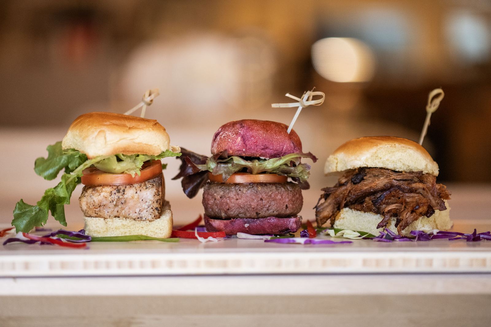 Three sliders lined up on the counter